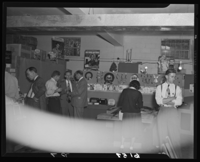 Radio Equipment Company, 377 East Main; interior; people gathered                             around display tables