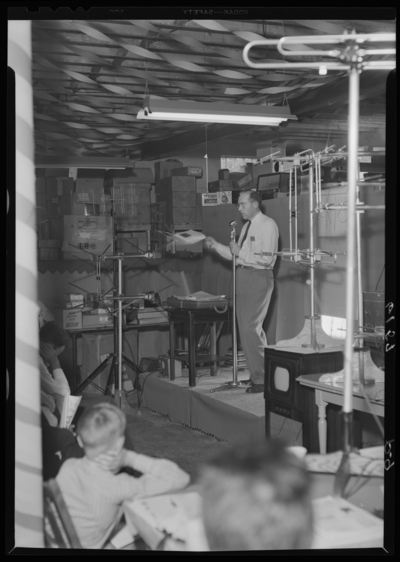 Radio Equipment Company, 377 East Main; interior; man talking                             into microphone