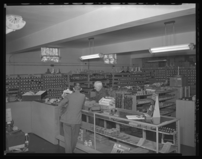 Radio Equipment Company, 377 East Main; interior; sales counter;                             employee serving customer