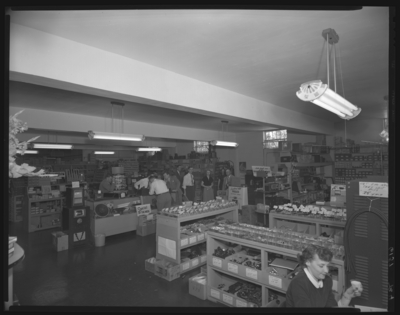 Radio Equipment Company, 377 East Main; interior; sales counter;                             employee serving customers