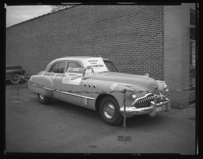 Kroger Store (East Main); Buick car giveaway; exterior; car                             parked next to building