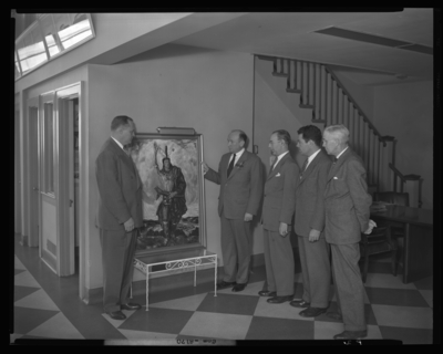 Charlie Sturgill Motor Company, 109-111 Rose; presentation of                             picture; group of men standing beside painting depicting an American                             Indian