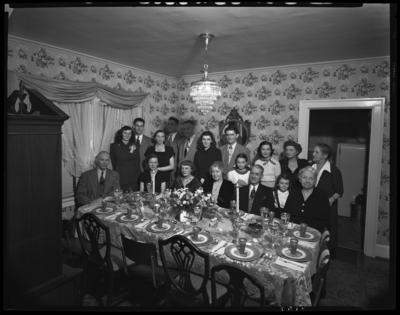 R.J. Long and Family (Lafayette Studios); interior; 4 brothers,                             sister, & family gathered around dinner table; group                             portrait