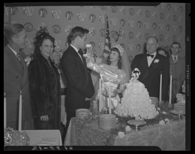 Mr. & Mrs. Ronald Lee Cole; wedding; interior; bride                             feeding groom cake