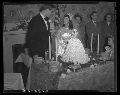 Mr. & Mrs. Ronald Lee Cole; wedding; interior; bride and                             groom cutting wedding cake