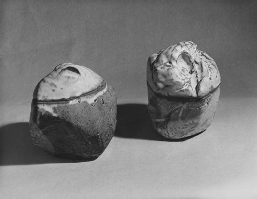 Two glazed round shaped ceramic pots by John Tuska
