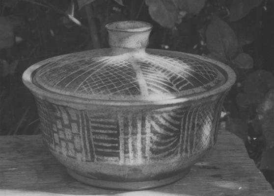 A ceramic pot with a lid, pieces of John Tuska's Alfred University graduate work