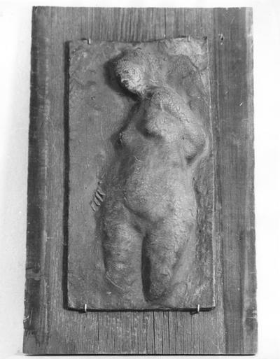 A clay relief of a female nude by John Tuska