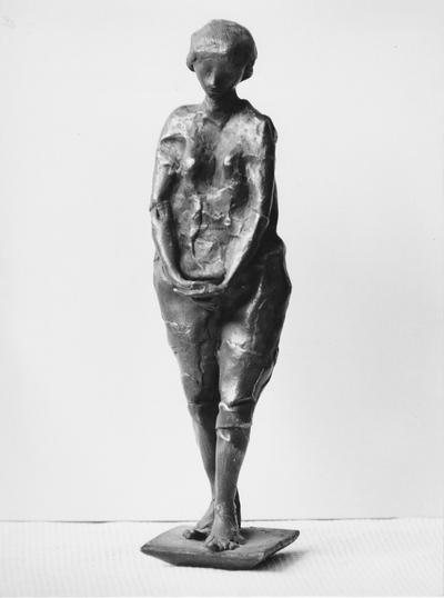 A bronze figure sculpture with a Georgian marble base entitled 