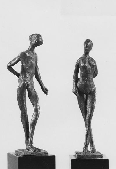 A pair of bronze sculptures, a male and female nude, with a black Belgian marble bases entitled 