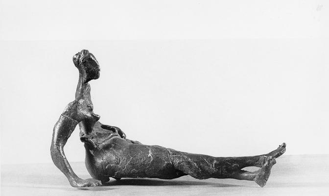 A bronze sculpture of a female sitting by John Tuska. This is one of the Italy inspired bronzes created during and after Tuska's trip to Italy in 1969