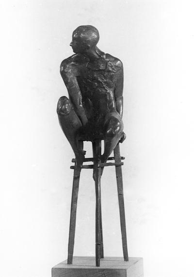 A bronze sculpture of a male nude on a high chair by John Tuska. This sculpture is one of the Italy inspired bronzes created during and after Tuska's trip to Italy in 1969