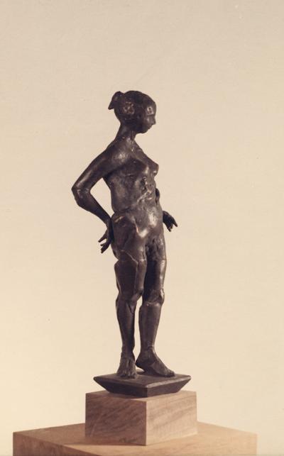 A bronze sculpture of a female nude entitled 