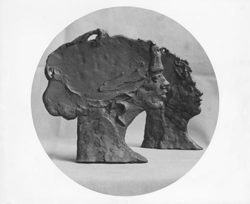 Two ceramic heads in profile by John Tuska