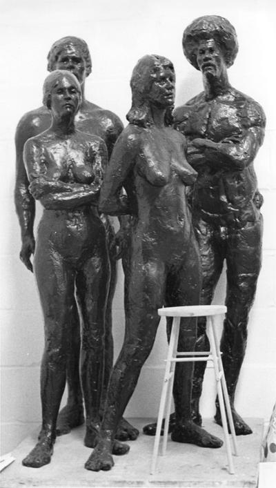Four fiberglass sculptures, two male and two female nudes, by John Tuska. The female nude sculpture with its hair pulled back was modeled by a woman named Pat