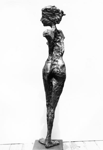 The back of a fiberglass sculpture of a female nude without arms by John Tuska