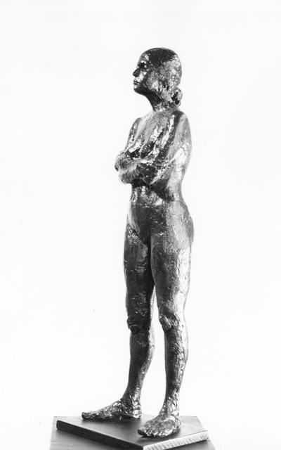 A fiberglass life size sculpture of a female nude standing with her arms crossed by John Tuska. The model's name is Pat. This is the same piece as in image 166