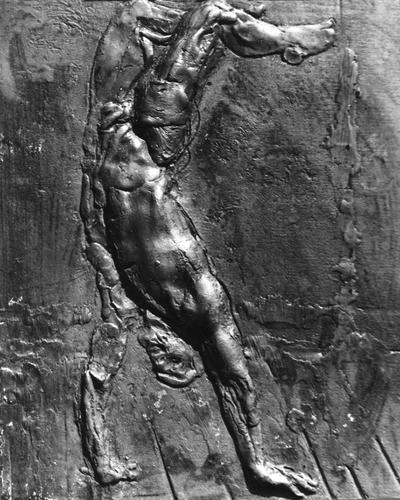 A fiberglass relief sculpture of a male nude falling by John Tuska. This piece is a part of Tuska's 