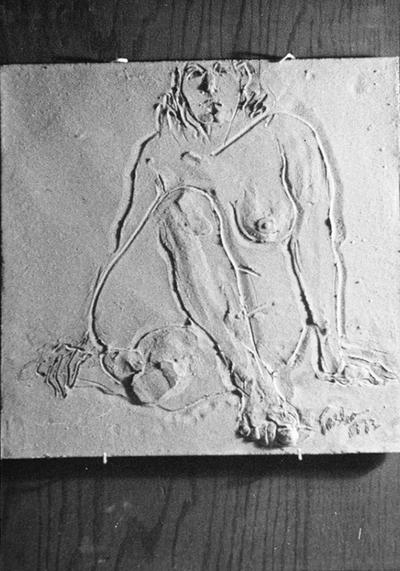 A ceramic tile relief of a sitting female nude by John Tuska