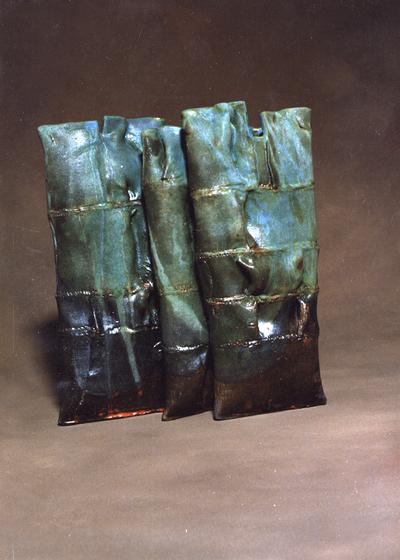 Three ceramic pouch vessels by John Tuska