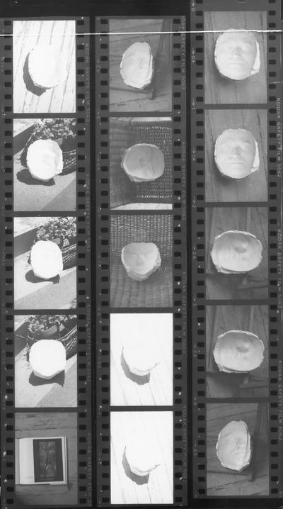A proof sheet showing a plaster mold made from John Tuska's face. Negatives of these photographs are located in Box 55