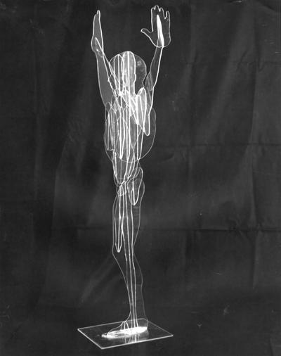 A Plexiglas figure sculpture entitled 