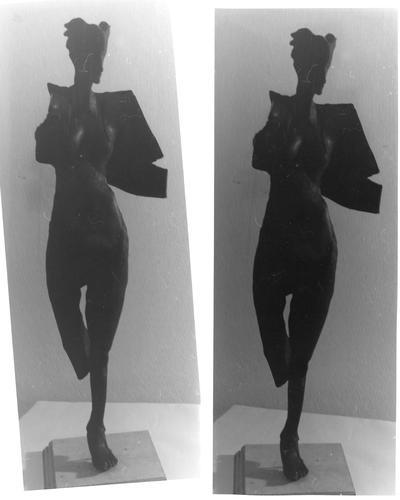 A bronze sculpture of a female nude entitled 