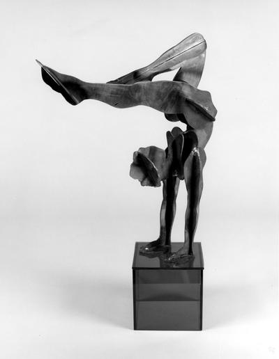 A corten steel figure sculpture entitled 