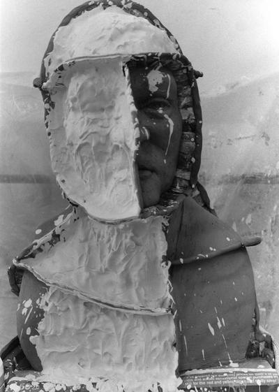 An image of plaster being applied to a John Sherman Cooper bust by John Tuska