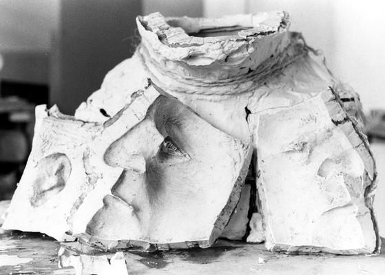 An image of a cracked plaster mold of a John Sherman Cooper bust by John Tuska