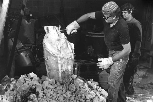 John Tuska and an unidentified man opening the John Sherman Cooper bust mold