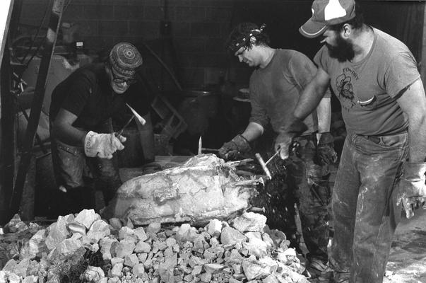 John Tuska, an unidentified man and Jack Gron removing plaster from the John Sherman Cooper bust mold