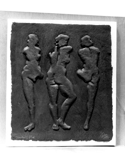 A cast paper sculpture of female nudes entitled 