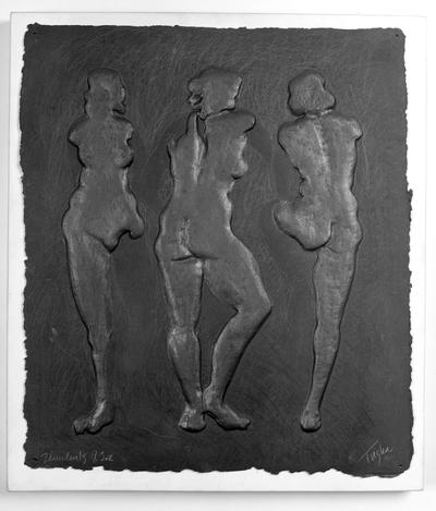A cast paper sculpture of female nudes entitled 