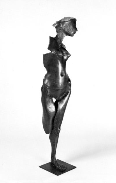 A bronze sculpture of a female nude entitled 