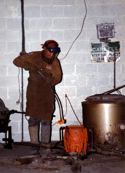 Scott Oberlink in the University of Kentucky foundry for the casting 