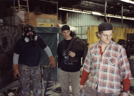 Scott Oberlink, an unidentified man and Andrew Marsh working in the University of Kentucky foundry during the casting 