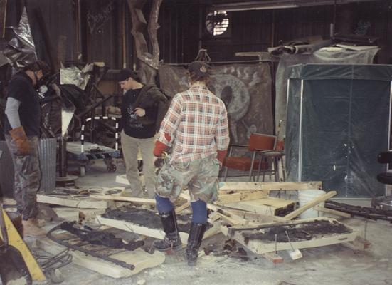 Scott Oberlink, an unidentified man and Andrew Marsh working in the University of Kentucky foundry during the casting 