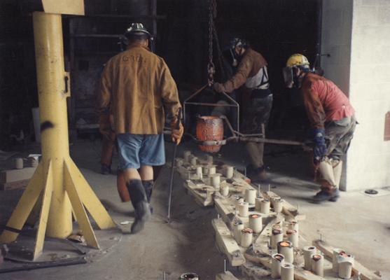 Jack Gron, Scott Oberlink and Andrew Marsh getting ready to pour bronze in the University of Kentucky foundry for 