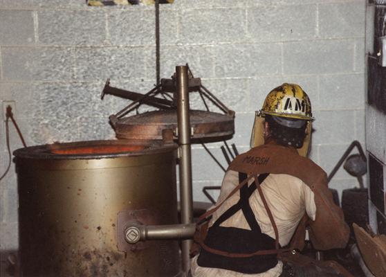 Andrew Marsh near the furnace in the University of Kentucky foundry during the casting of 
