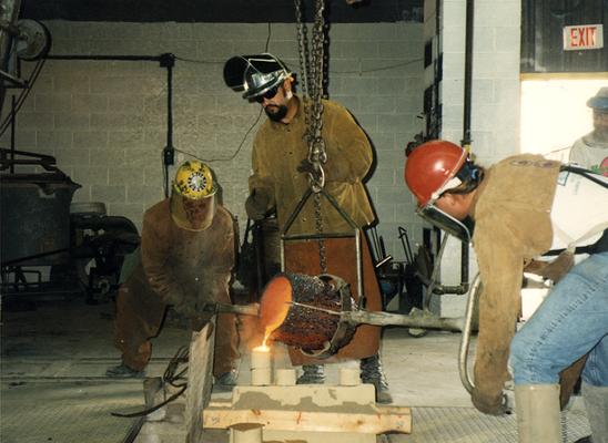 Andrew Marsh, Jack Gron and Scott Oberlink pouring bronze at the University of Kentucky foundry for the casting of 