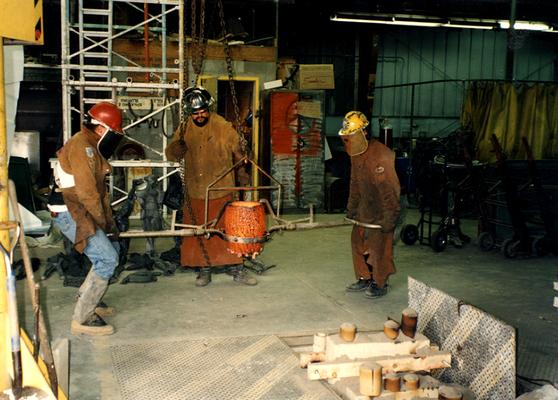 Scott Oberlink, Jack Gron and Andrew Marsh getting ready to pour bronze at the University of Kentucky foundry for the casting of 