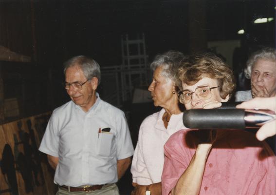 Four unidentified persons at the University of Kentucky foundry viewing 