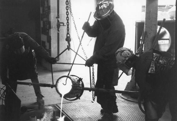 Scott Oberlink, Jack Gron and Andrew Marsh pouring bronze for the last cast at the University of Kentucky foundry of 