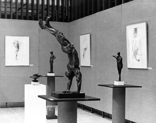 Four bronze figure sculptures, one entitled 