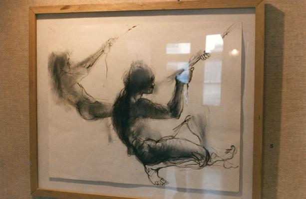 A charcoal and ink drawing of two human figures in an exhibit entitled 