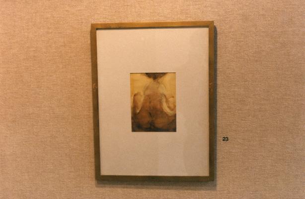 A water color painting of a human figure in an exhibit entitled 