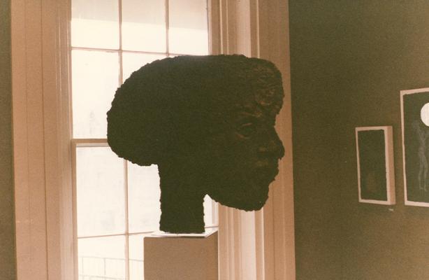 A cast paper sculpture of a human head in an exhibit entitled 