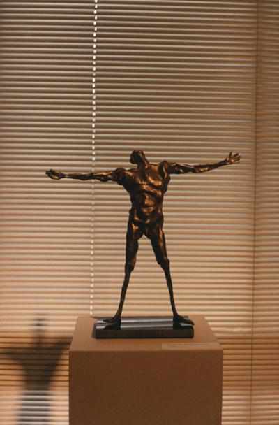 A bronze figure sculpture entitled 