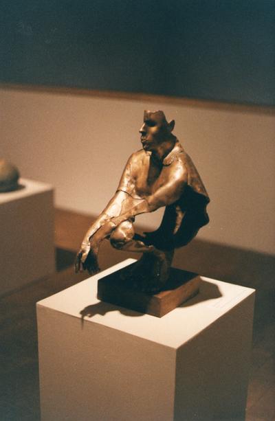 A bronze figure sculpture entitled 